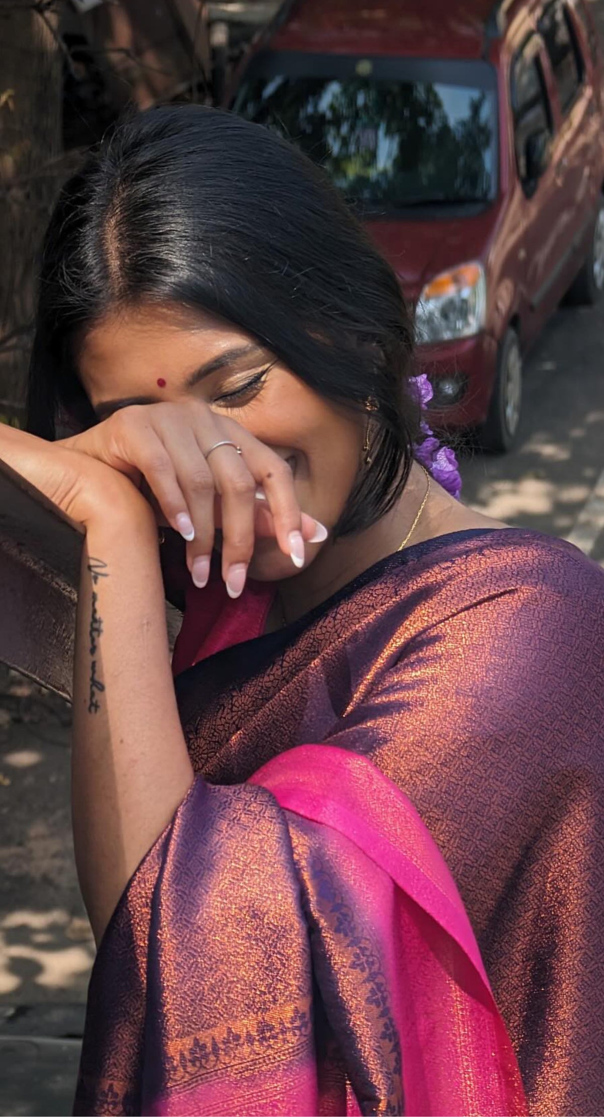 A model of le pleat draped in a lightweight banana's art silk saree with a pink silk blouse and dark blue saree shaper.