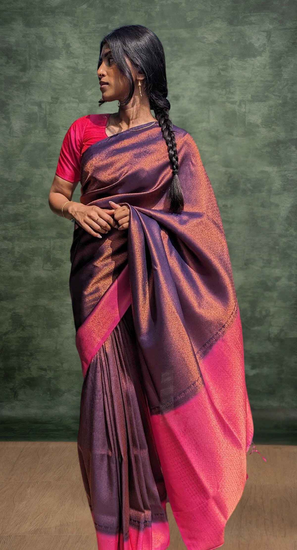 A model of le pleat draped in a lightweight banana's art silk saree with a pink silk blouse and dark blue saree shaper.