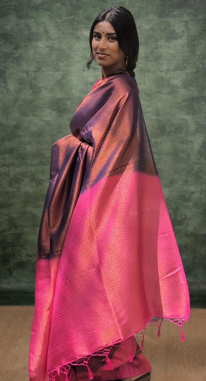 A model of le pleat draped in a lightweight navy blue banana's art silk saree and pink pallu with a pink silk blouse and dark blue saree shaper.