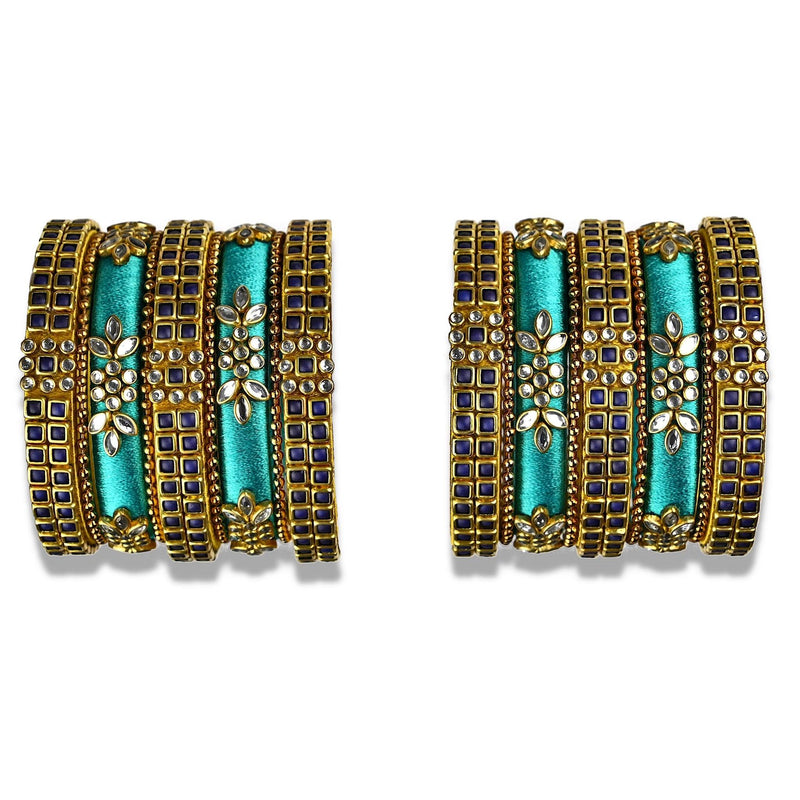 A glittering set of silk thread bangles embellished with navy kundan stones in teal silk thread with floral decoratives.