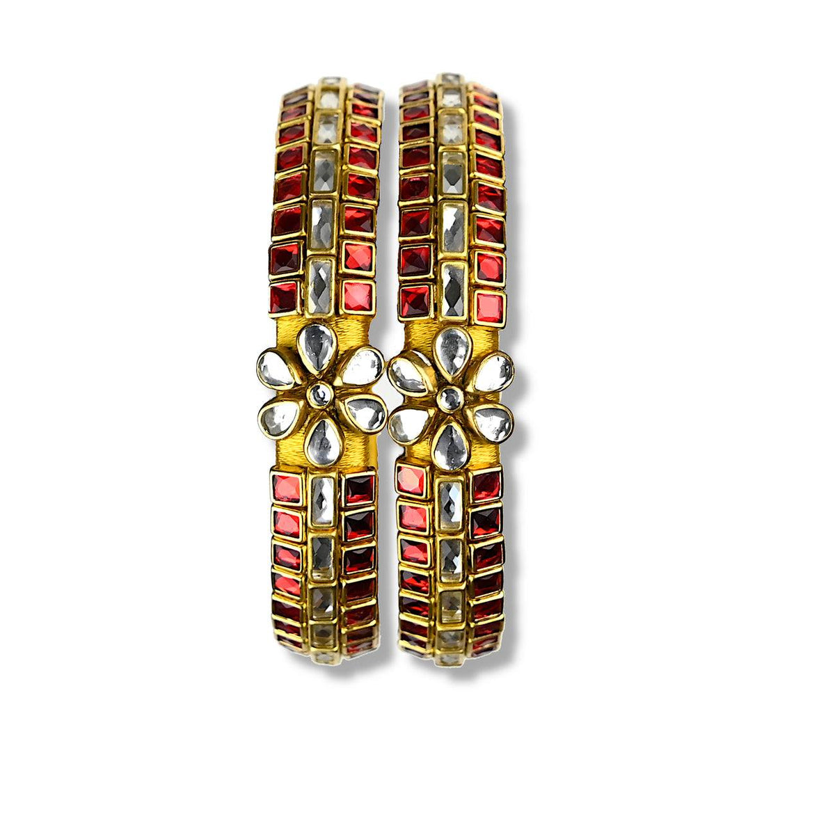 A fancy Kundan stone bangle designed in three layers embellished with ruby red and glass colored kundan stone bezels over golden silk threads. A modern South Asian jewelry trend.