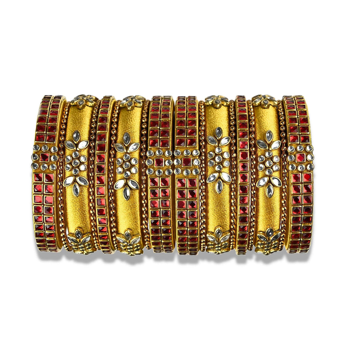 A divine set of Silk Thread Bangles beautifully ornamented with gold silk thread and ruby red kundan stone bezels. The bangles comes in a set of 18 with 9 for each hand.