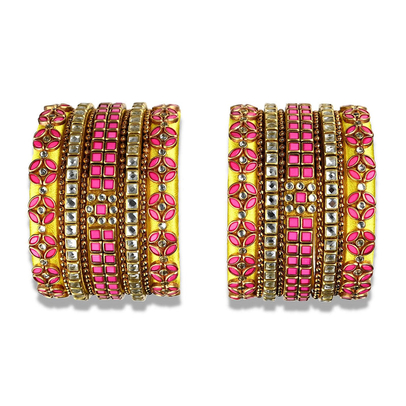 A glittering set of silk thread bangles embellished with pink & glass kundan stones in yellow silk thread with unique motifs.
